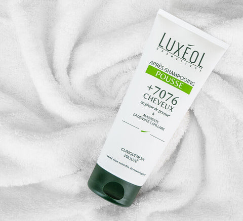 Conditioner tube on towel, ready to use.