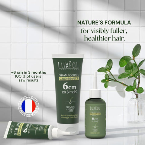Luxéol juuksehooldustooted tekstiga plaaditud seina taustal